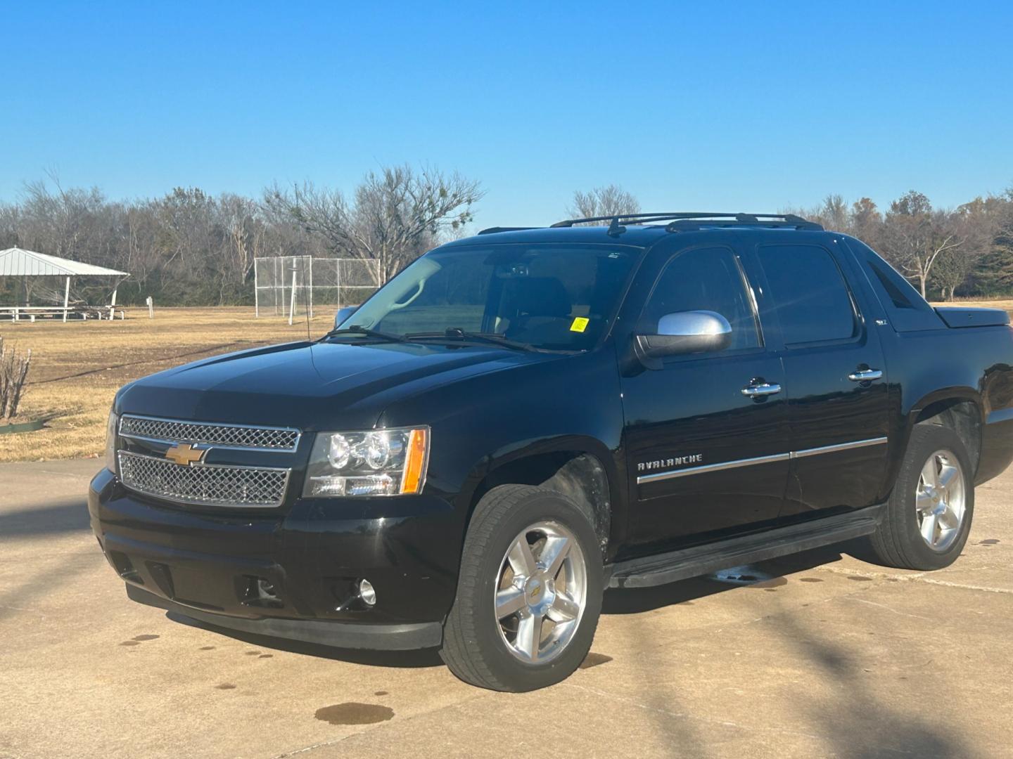 2012 BLACK /BLACK Chevrolet Avalanche LTZ (3GNTKGE75CG) with an 5.3L V8 OHV 16V FFV engine, AUTOMATIC transmission, located at 17760 Hwy 62, Morris, OK, 74445, (918) 733-4887, 35.609104, -95.877060 - 2012 CHEVROLET AVALANCHE LTZ HAS A 5.3L V8 ENGINE AND IS 4WD. THIS TRUCK IS BI-FUEL WHICH RUNS ON BOTH CNG(COMPRESSED NATURAL GAS) OR GASOLINE, IT FEATURES KEYLESS ENTRY REMOTE, REMOTE START, POWER LOCKS, POWER WINDOWS, POWER SEATS, POWER MIRRORS, POWER ADJUSTABLE FOOT PEDAL, AM/FM STEREO, CD PLAYER - Photo#0